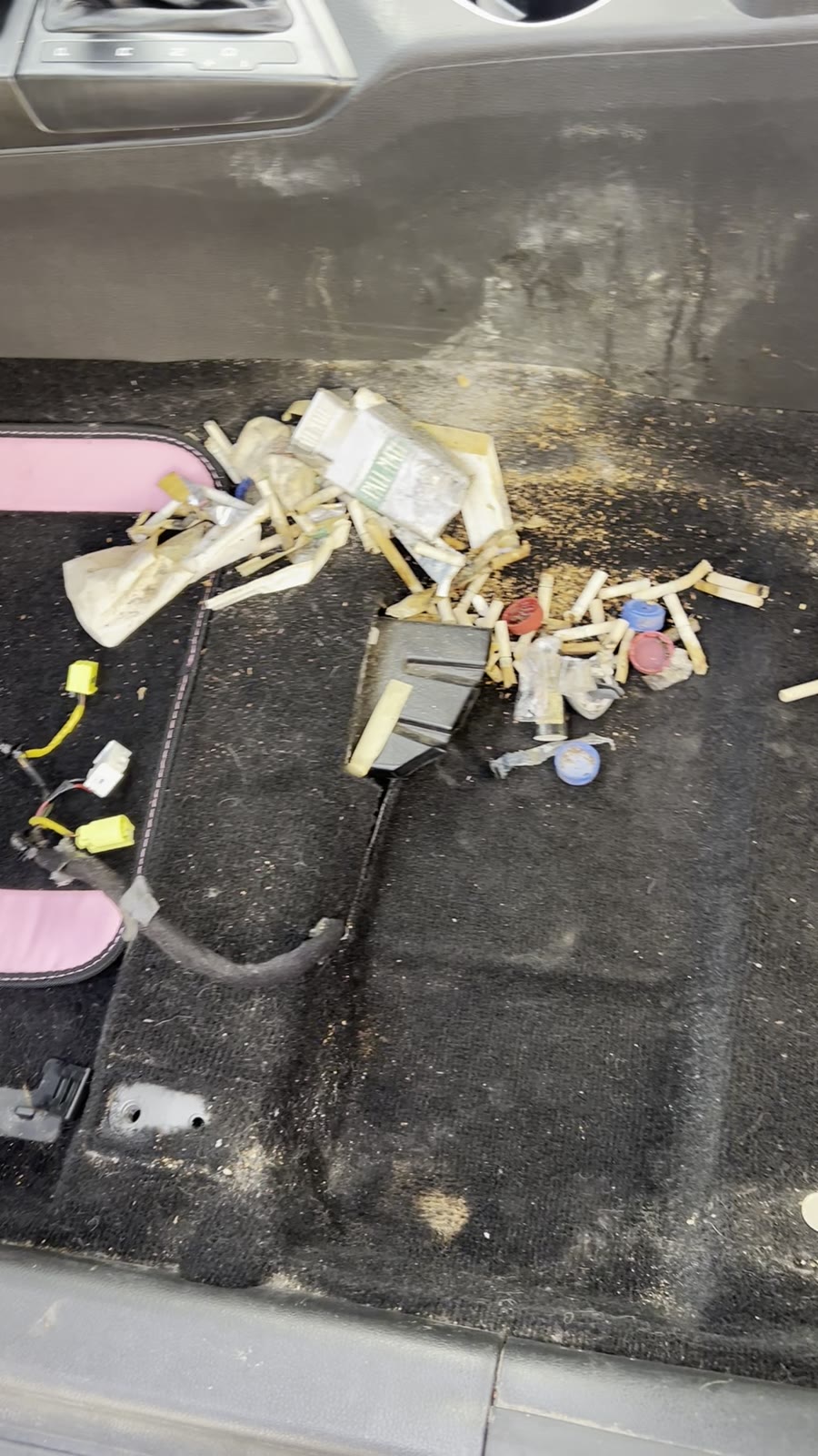 Rear footwell before cleaning, ground-in dirt and food debris